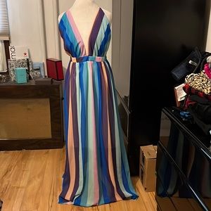 Multicolored striped dress that crisscrosses in back w/ a plunging sexy neckline